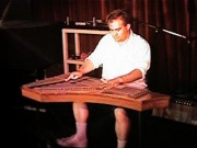 Brian playing zither. Photo courtesy TDK.